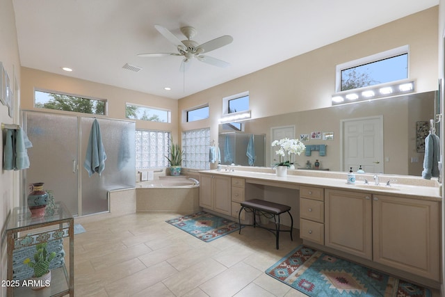 bathroom with tile patterned floors, vanity, ceiling fan, and shower with separate bathtub