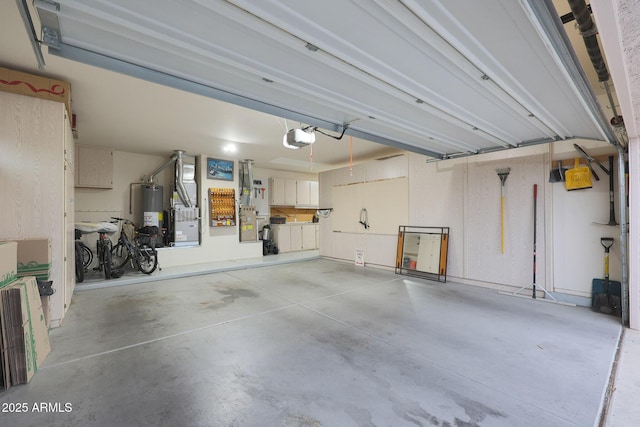 garage with gas water heater and a garage door opener