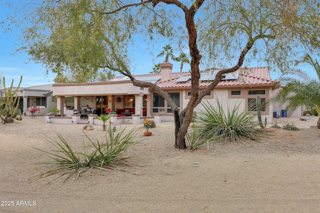 rear view of property featuring a patio area