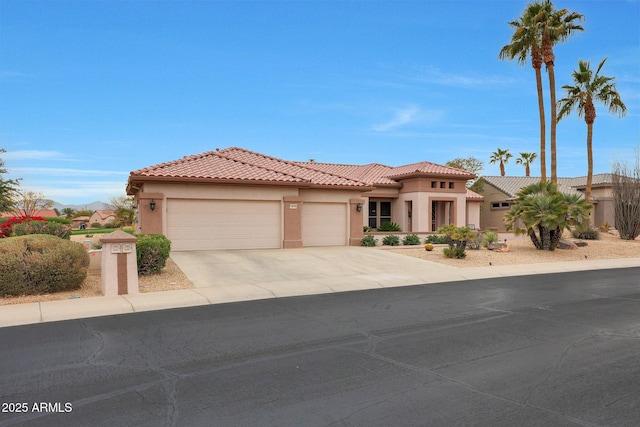 mediterranean / spanish-style home featuring a garage