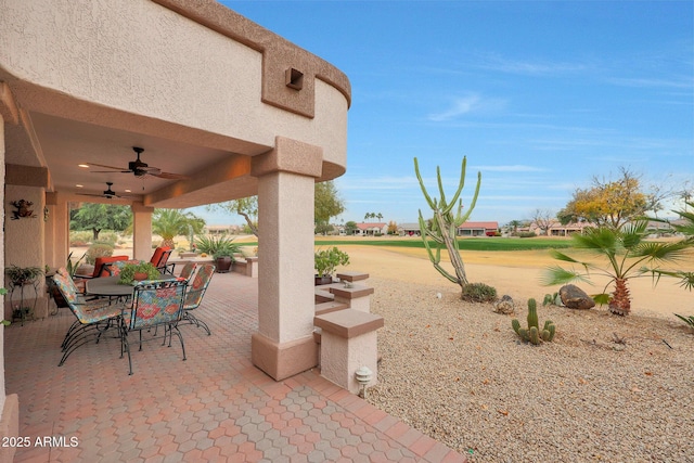 view of patio / terrace featuring ceiling fan