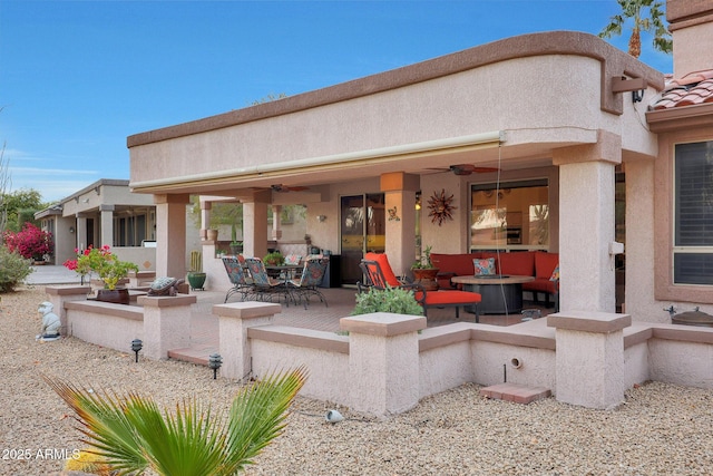 view of patio featuring an outdoor hangout area and ceiling fan