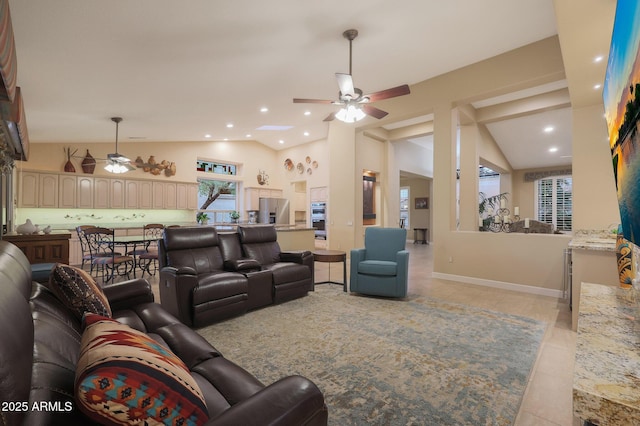 living room with ceiling fan, light tile patterned floors, and high vaulted ceiling