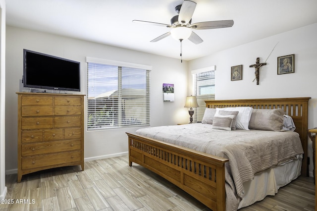 bedroom featuring light hardwood / wood-style floors and ceiling fan