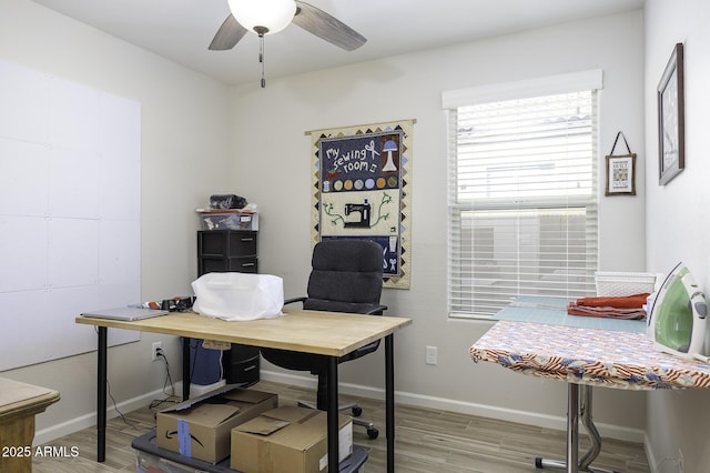 office space with light hardwood / wood-style floors and ceiling fan