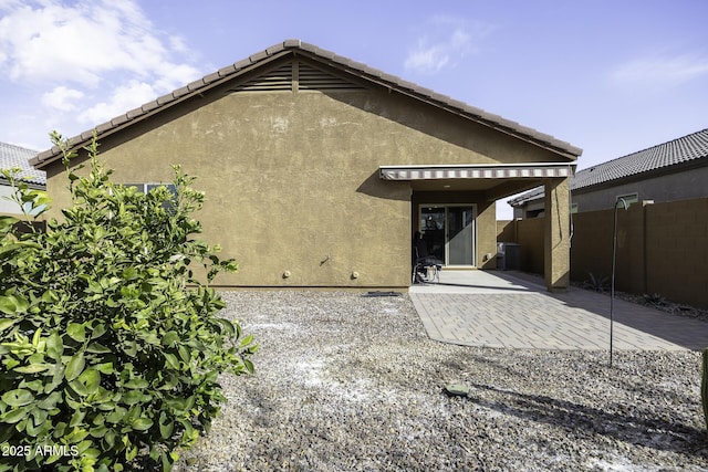 back of house with a patio area