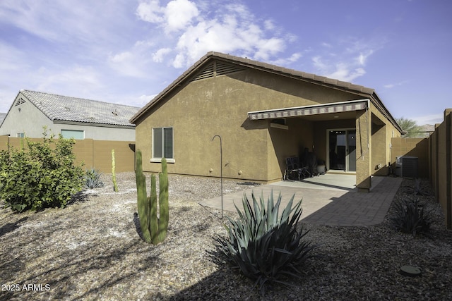 rear view of property with a patio area