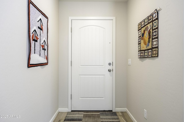 doorway to outside featuring wood-type flooring