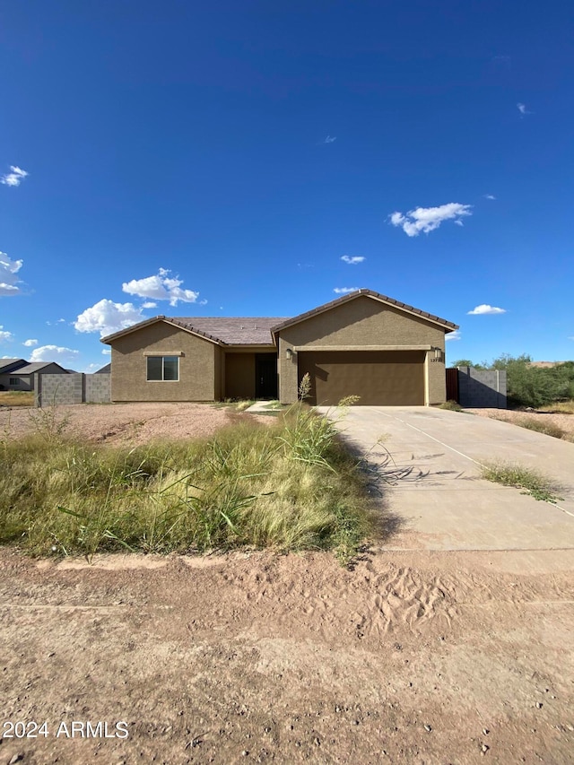 ranch-style house featuring a garage