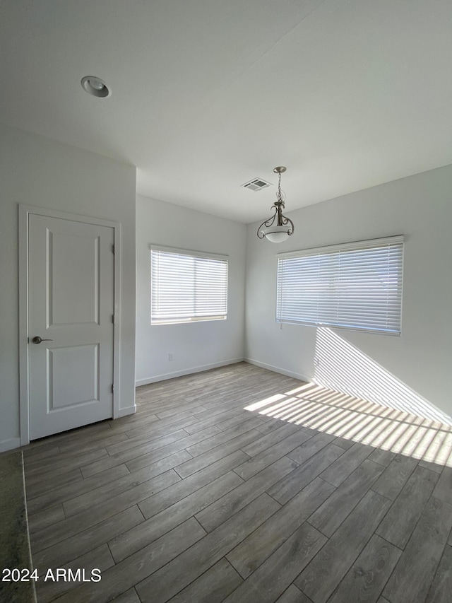 empty room with dark hardwood / wood-style flooring