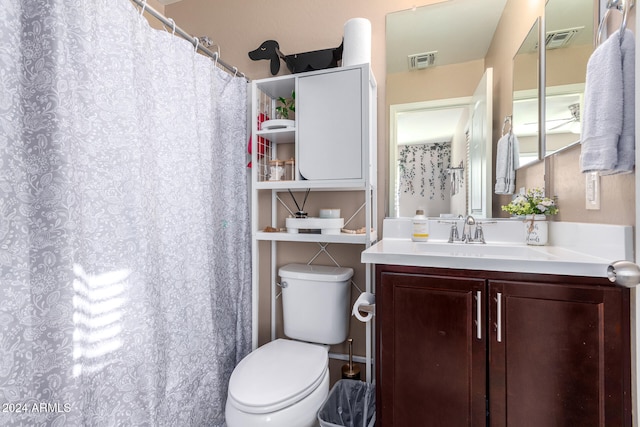 bathroom with toilet and vanity