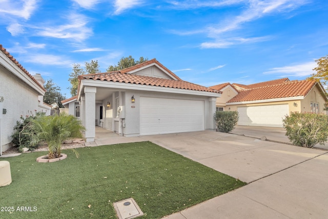 mediterranean / spanish-style house with a garage and a front yard