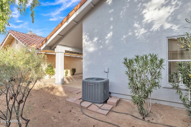 exterior space featuring a patio and central air condition unit