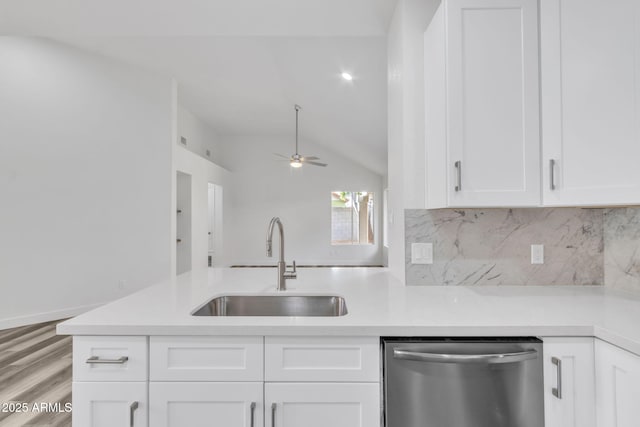 kitchen featuring sink, stainless steel dishwasher, and white cabinets