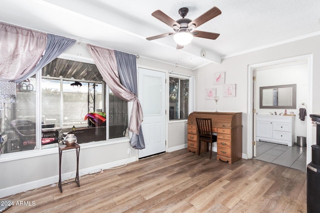 office area with beam ceiling, hardwood / wood-style flooring, ceiling fan, and sink