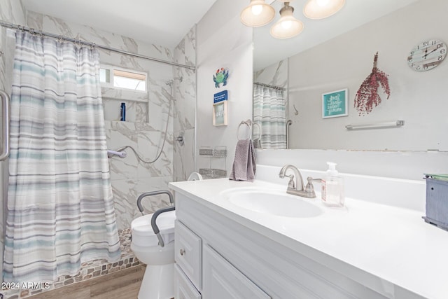 bathroom featuring a shower with curtain, hardwood / wood-style floors, and vanity