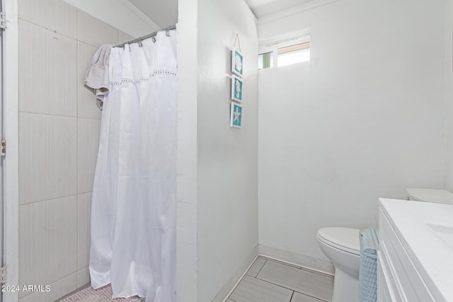 bathroom with tile patterned flooring, vanity, toilet, and a shower with shower curtain