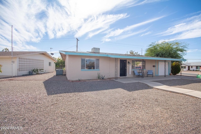 single story home featuring a garage