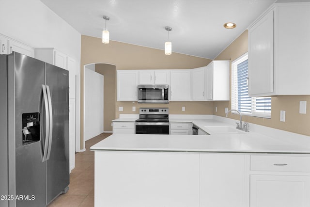 5252 W Pontiac Dr, Glendale, AZ 85308 - kitchen with appliances with stainless steel finishes, a peninsula, light countertops, lofted ceiling, and a sink