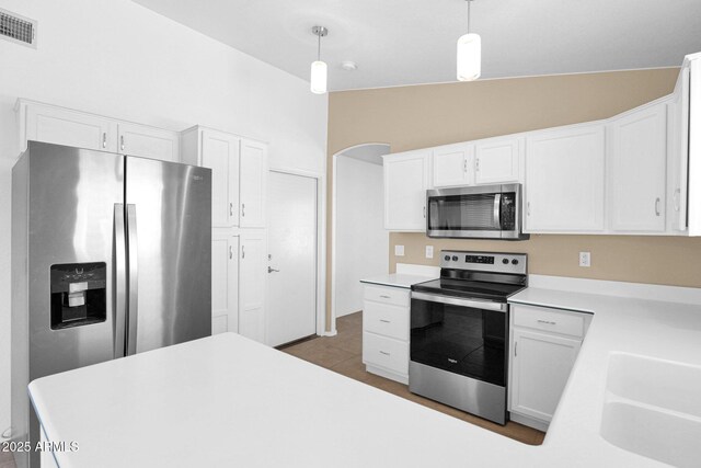 5252 W Pontiac Dr, Glendale, AZ 85308 - kitchen featuring visible vents, a sink, light countertops, appliances with stainless steel finishes, and white cabinetry