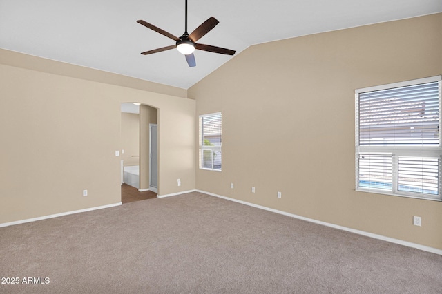 5252 W Pontiac Dr, Glendale, AZ 85308 - carpeted spare room with arched walkways, high vaulted ceiling, baseboards, and a ceiling fan