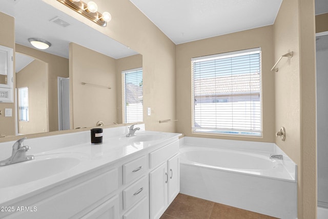 5252 W Pontiac Dr, Glendale, AZ 85308 - full bathroom with a sink, double vanity, tile patterned flooring, and a garden tub