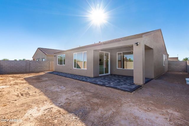 back of house featuring a patio area