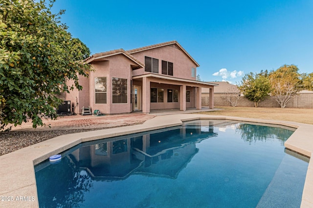 view of pool featuring central AC unit and a patio area