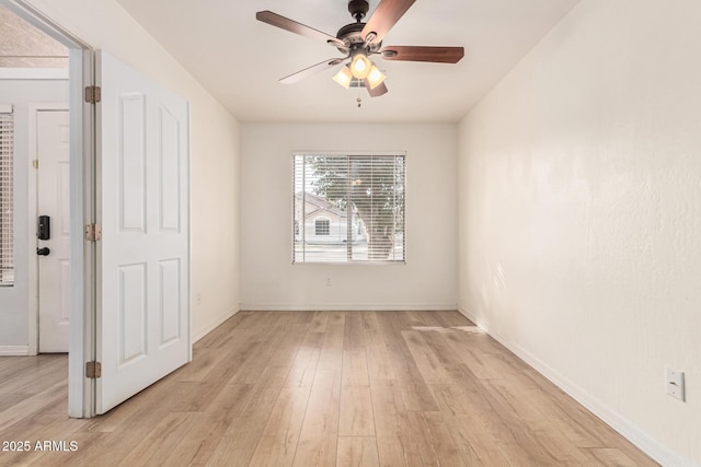 unfurnished room with ceiling fan and light wood-type flooring