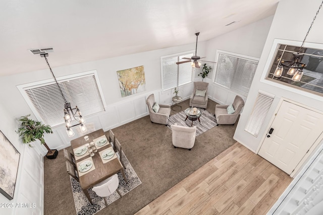 living room featuring hardwood / wood-style flooring and lofted ceiling