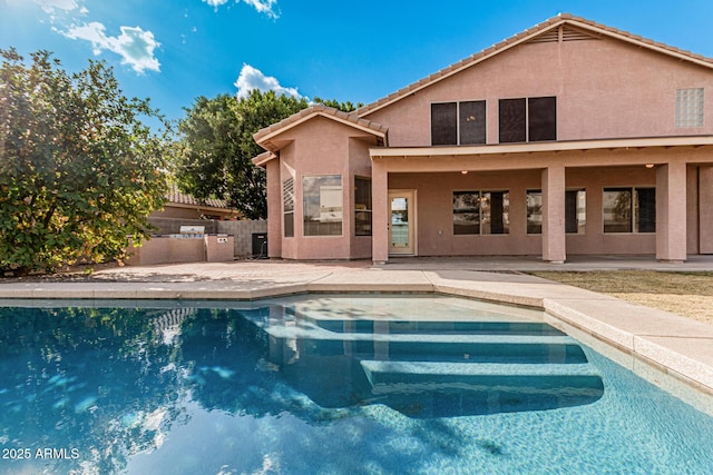 view of swimming pool featuring a patio area