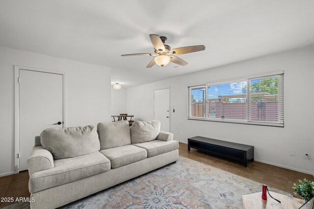 6008 W Augusta Ave, Glendale, AZ 85301 - living area with a ceiling fan and tile patterned flooring