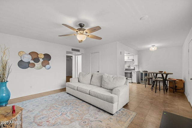6008 W Augusta Ave, Glendale, AZ 85301 - living area with light tile patterned floors and ceiling fan