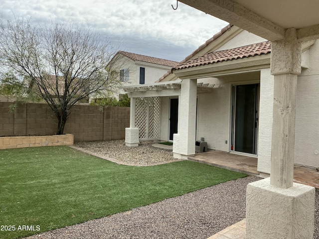 view of yard featuring a patio, a pergola, and fence