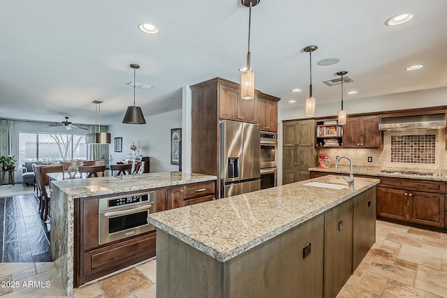 402 E Claremont St, Phoenix, AZ 85012 - kitchen with stainless steel appliances, an island with sink, open shelves, a sink, and tasteful backsplash