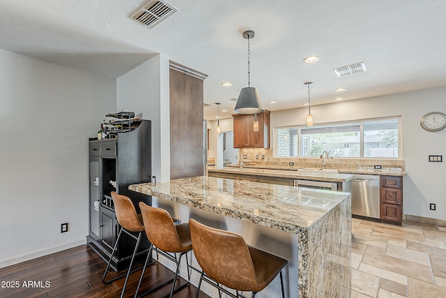 402 E Claremont St, Phoenix, AZ 85012 - kitchen with dishwasher, a sink, light stone counters, baseboards, and recessed lighting