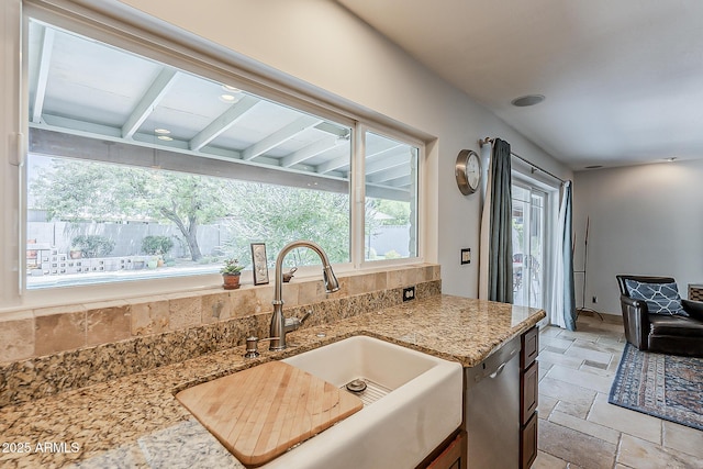 402 E Claremont St, Phoenix, AZ 85012 - kitchen with a sink, stone tile floors, light stone countertops, and stainless steel dishwasher