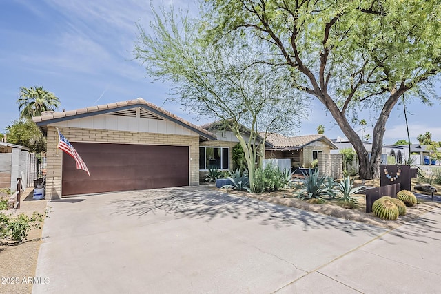 402 E Claremont St, Phoenix, AZ 85012 - ranch-style house with an attached garage, driveway, and a tile roof