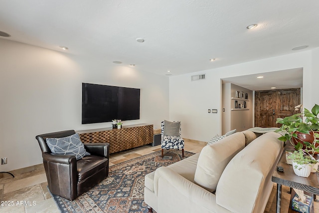 402 E Claremont St, Phoenix, AZ 85012 - living area with recessed lighting and stone tile floors