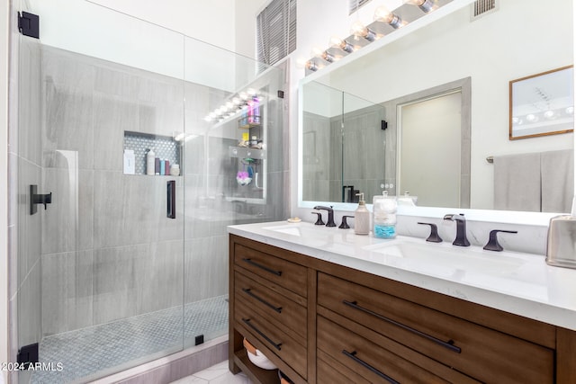 bathroom with vanity, a shower with shower door, and tile patterned flooring