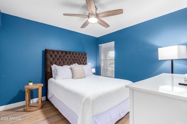 bedroom featuring ceiling fan and light wood-type flooring