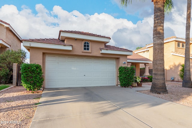 mediterranean / spanish-style house featuring a garage