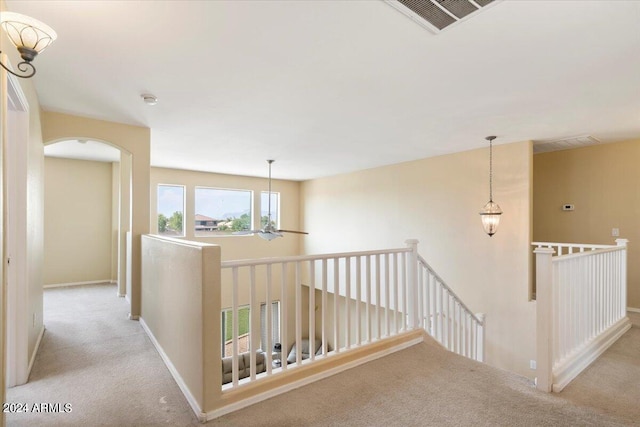 hallway with light carpet