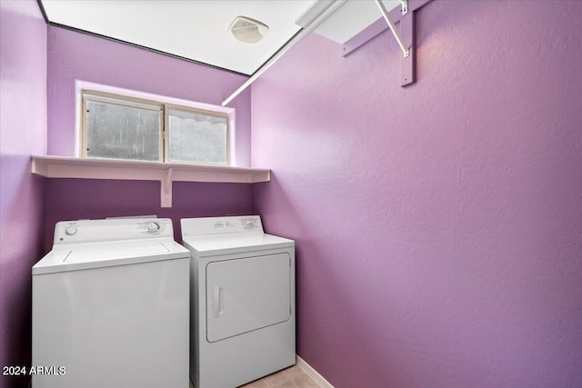 clothes washing area featuring independent washer and dryer