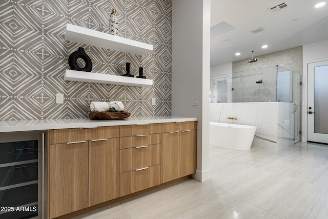 bar with wine cooler, visible vents, wallpapered walls, and recessed lighting