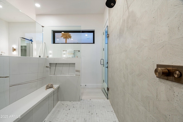 full bath with recessed lighting and a shower stall