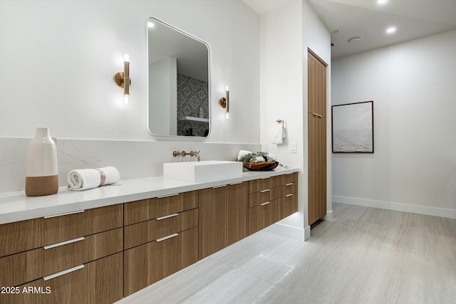 bathroom featuring vanity and baseboards