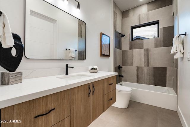 bathroom featuring toilet, tub / shower combination, vanity, and tile patterned floors