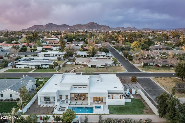 birds eye view of property with a residential view and a mountain view