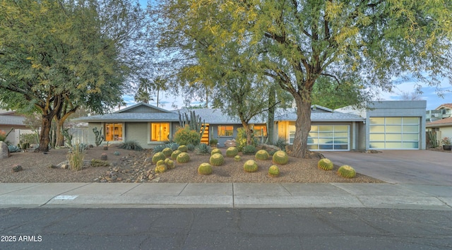 ranch-style home featuring a garage